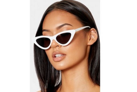 lady wearing cateye sunglasses in nz. White frames 